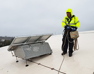 Ixom Watercare Onsite Service Team Member on drinking water tank