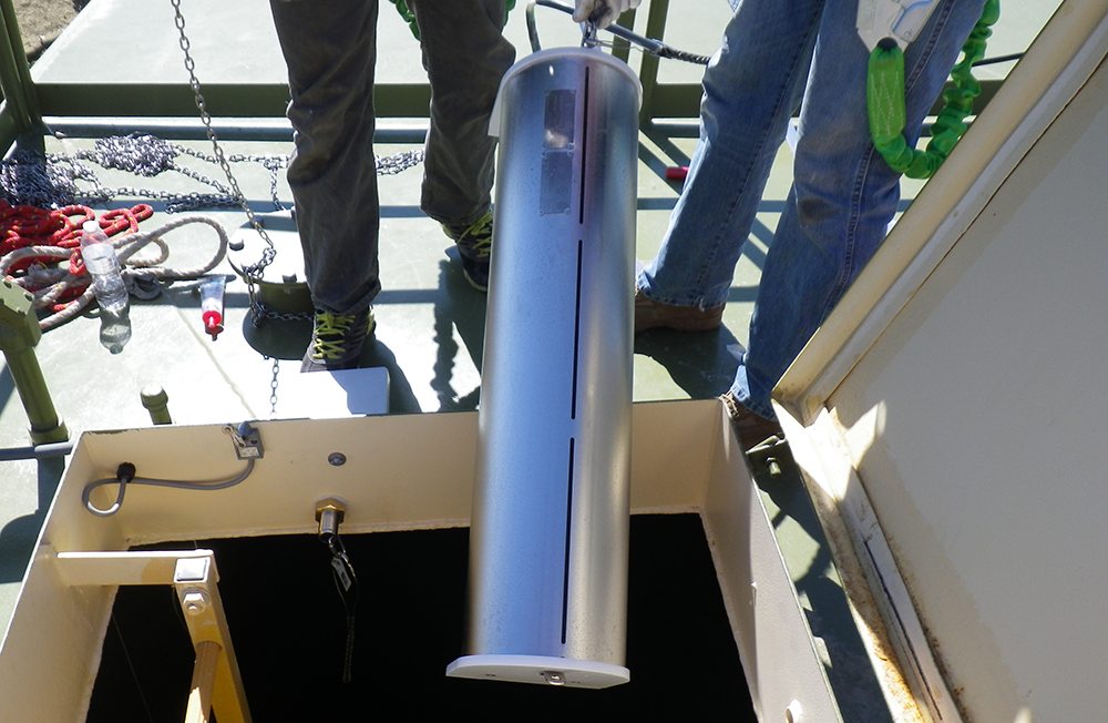 gridbee gs series mixer being lowered through the hatch of a municipal drinking water tank