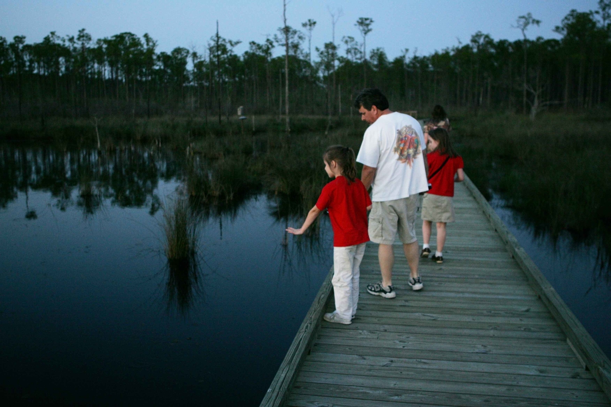 Family walking on dock.